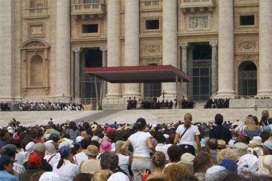 Although we were pretty far away, we were able to make him out.  He is the one in white.  What really was impressive to me in this photo is the magnitude of Basilica di San Pietro (Saint Peter's Basilica) in the backdrop.