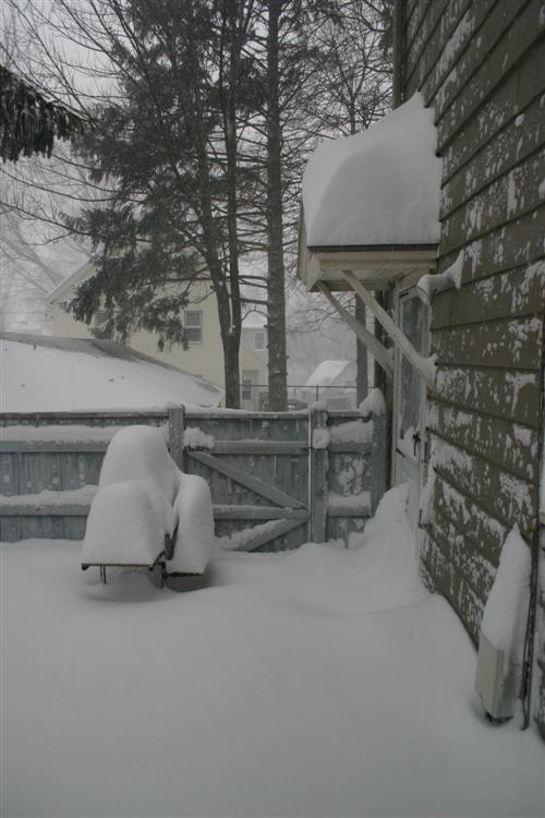 Grill and snow on overhang