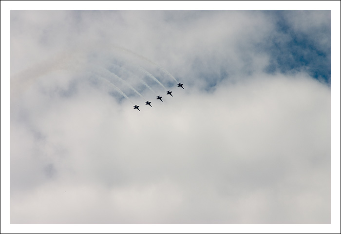 As the wedding party got ready the men stood on top of a building and looked up.
